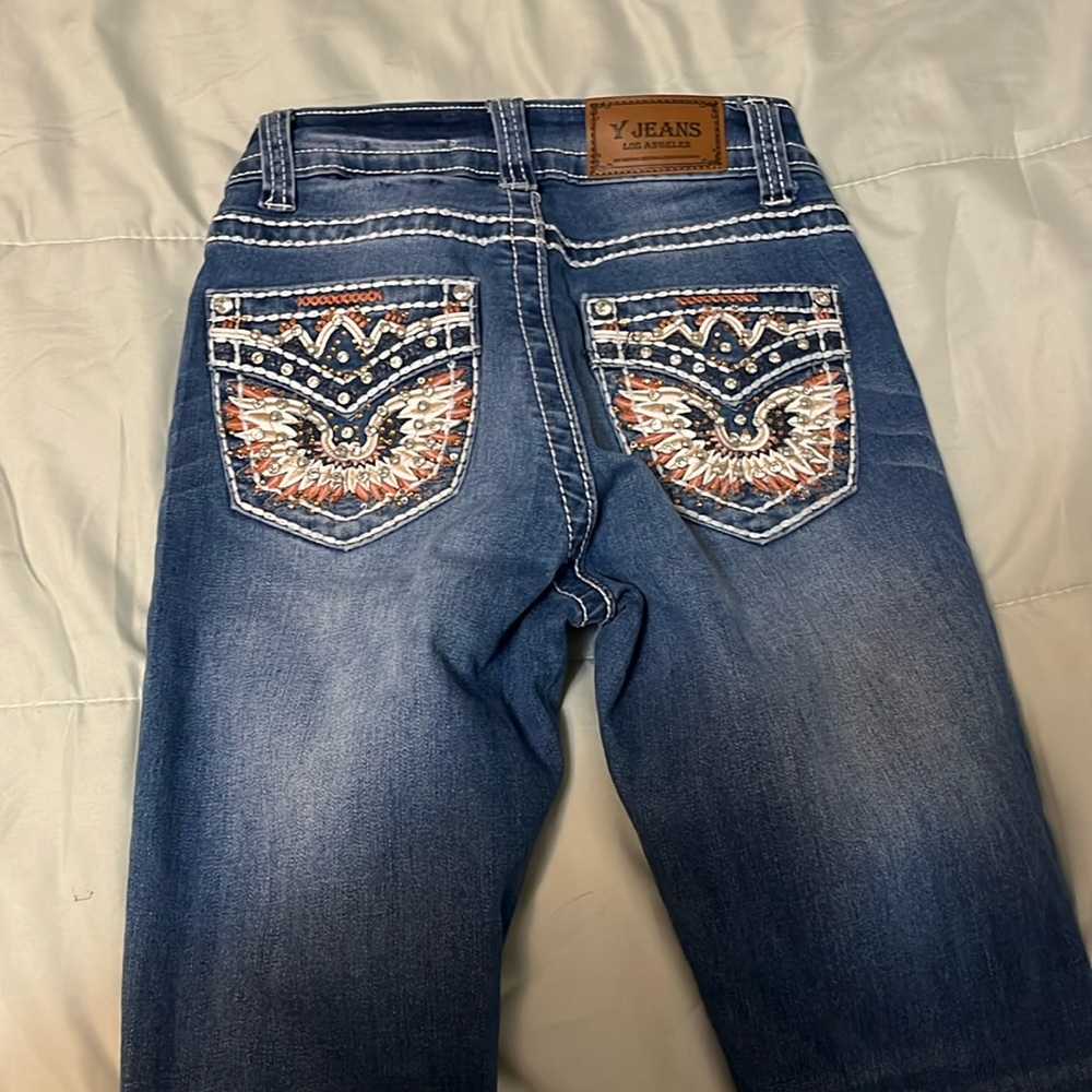 I’m selling some y jeans never worn before brand new tag size 00